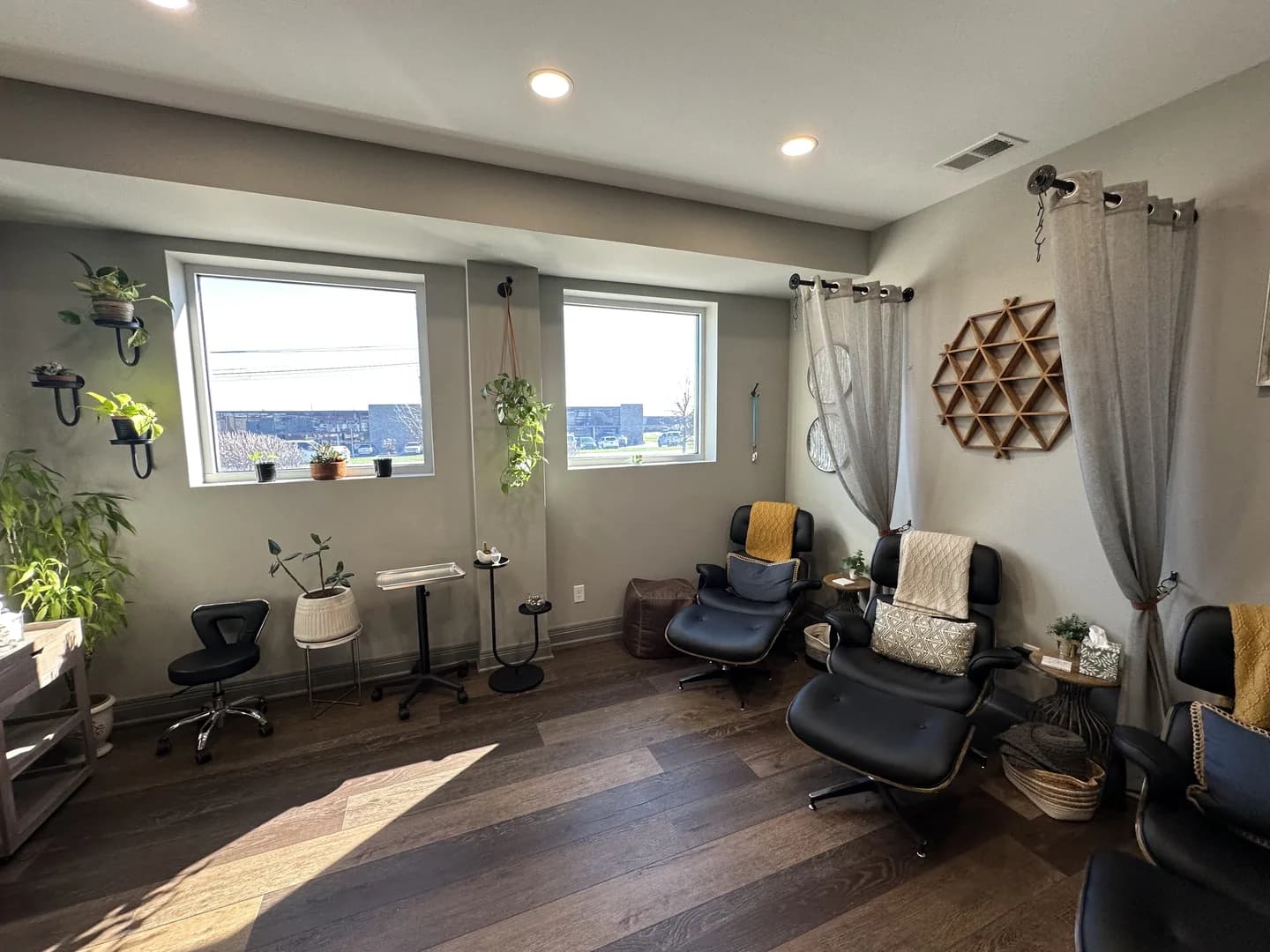The LouWellSpa lounge with reclining chairs, plants and window light